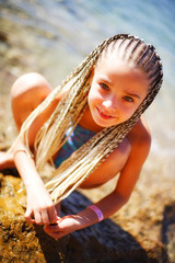 portrait of a pretty little girl on the beach