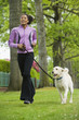 © Don Mason/Blend Images - African American woman jogging with dog