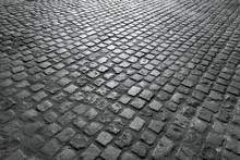 Old English Cobblestone Road Close Up In Black And White.