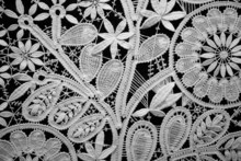 Lace Doily On Black Background, Close Up. Horizontal Format.