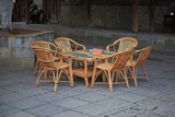 Fototapeta Miasto - some bamboo furniture in the courtyard