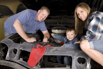 Wall Mural - happy family working on car