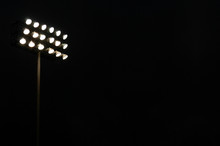 Stadium Lights On A Sports Field At Night With Copy Space