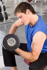 Canvas Print - man exercising with barbells