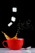 Cup of coffee with sugarcubes