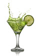 Green alcohol cocktail with splash and green lime