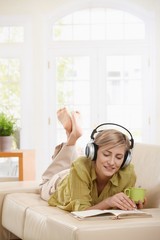 Poster - Woman resting on couch at home