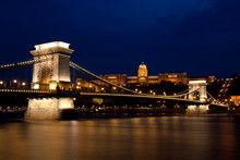 Royal Palace And Chain Bridge At Night In Budapest