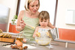© CandyBox Images - Baking - Woman with child preparing dough