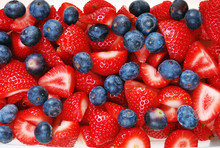 Sliced Strawberries And Blueberries