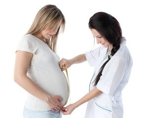 Pregnant woman and doctor.