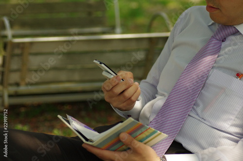 公園でメールを打つビジネスマン Buy This Stock Photo And Explore Similar Images At Adobe Stock Adobe Stock