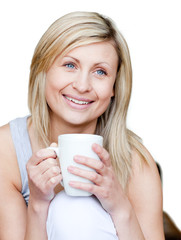 Wall Mural - Attractive woman holding a cup of coffee