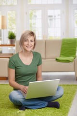 Poster - Happy woman with laptop at home