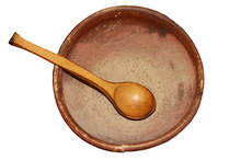 An Old Wooden Plate And Spoon