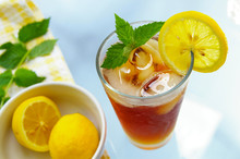 Tall Glass Of Iced Tea With Lemon And Fresh Mint