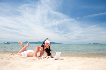 Sticker - Cute woman with white laptop on the summer beach