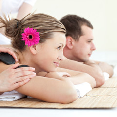 Canvas Print - Cheerful young couple enjoying a Spa treatment