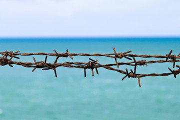 wire fence on the beach