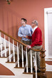 © Kablonk Micro - Man helping senior father climb stairs at home