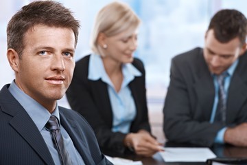 Poster - Portrait of businessman at meeting