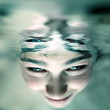 © Sabphoto - Photo of boy face under water
