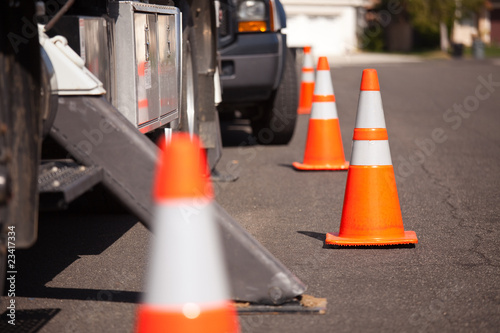 Fotografie, Obraz Orange Hazard Cones and Utility Truck in Street