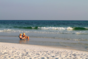 Women Reading At Beach