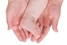 Children Foot And Adult Hand