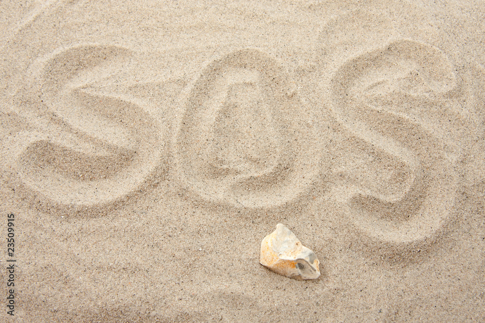 SOS letters in sand Stock Photo | Adobe Stock