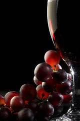 Red wine with grapes