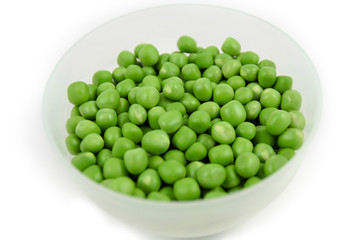 green peas in a bowl isolated on white