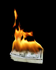 a pile of 10 dollar bills on fire