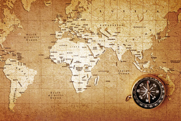  An old brass compass on a Treasure map background