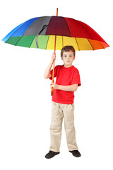 Wall Mural - little boy in red shirt with big multicolored umbrella standing