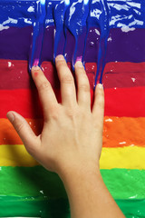 Wall Mural - Hand in colorful paint