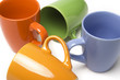 Coffee mugs with four different colors over white
