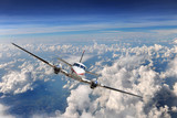 Fototapeta Fototapeta z niebem - Airplane Flying above the clouds