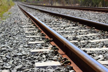 iron rusty train railway detail over dark stones