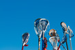 Many lacrosse sticks in the air