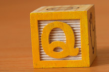 Alphabet Block With A Yellow Letter Q