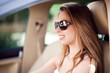 © get4net - Beautiful woman driving car with sunglasses on