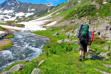 Hiker in Caucasus mountains