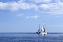 Sailboat Sailing On Blue Sea Horizon Ocean