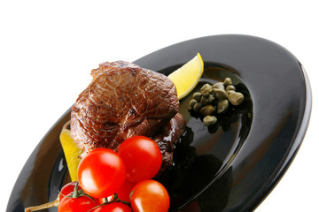 roast meat medallion with cherry tomatoes