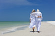 © Darren Baker - Rear View of Senior Couple Walking Alone on A Tropical Beach