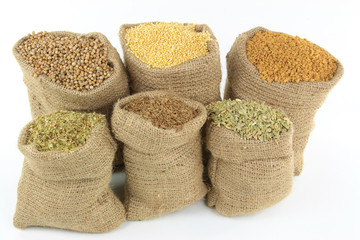 Ingredients, Seasonings, Spices and Herbs in burlap sacks.