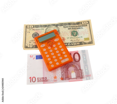 Calculator With 10 Euro And Dollar Banknotes On A White Calculator With 10 Euro And Dollar Banknotes On A White