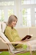 © nyul - Woman reading at home