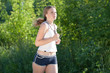 © Justaman - Portrait of a young woman jogging outdoor